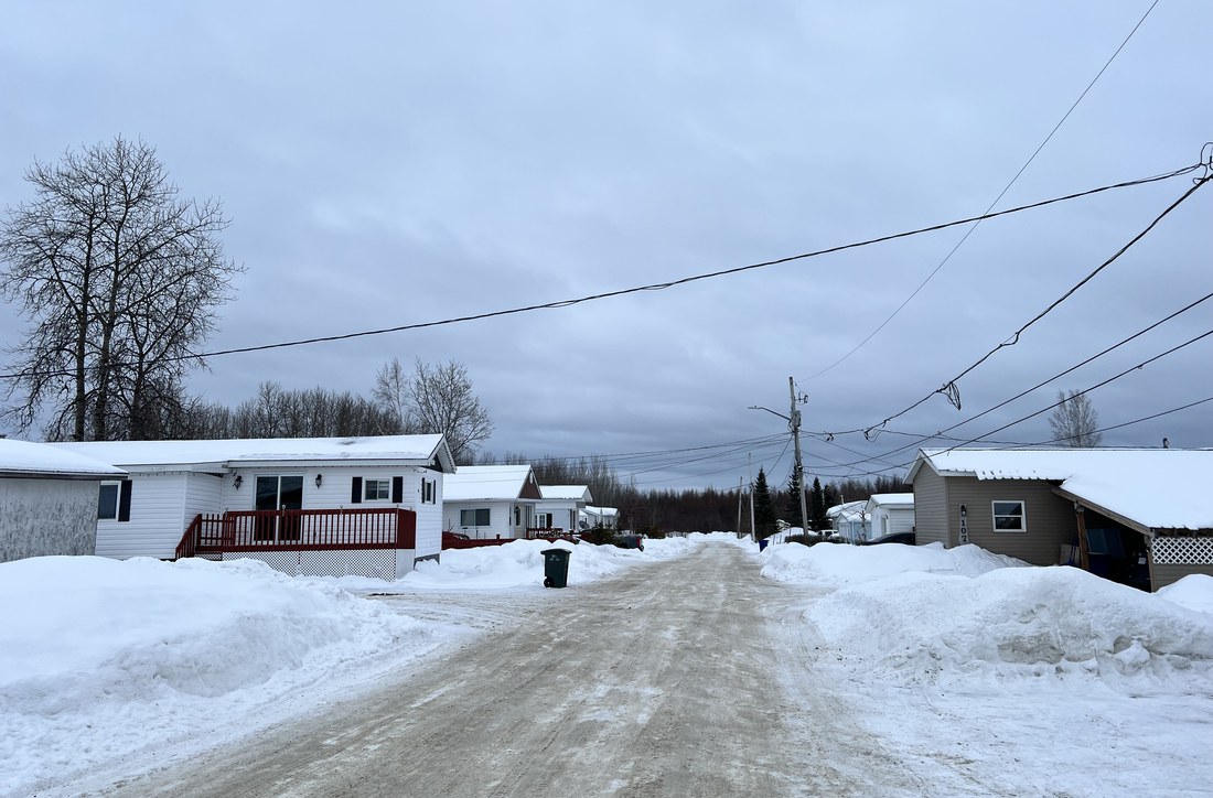 A winter road inside Cochrane Mobile Home Park